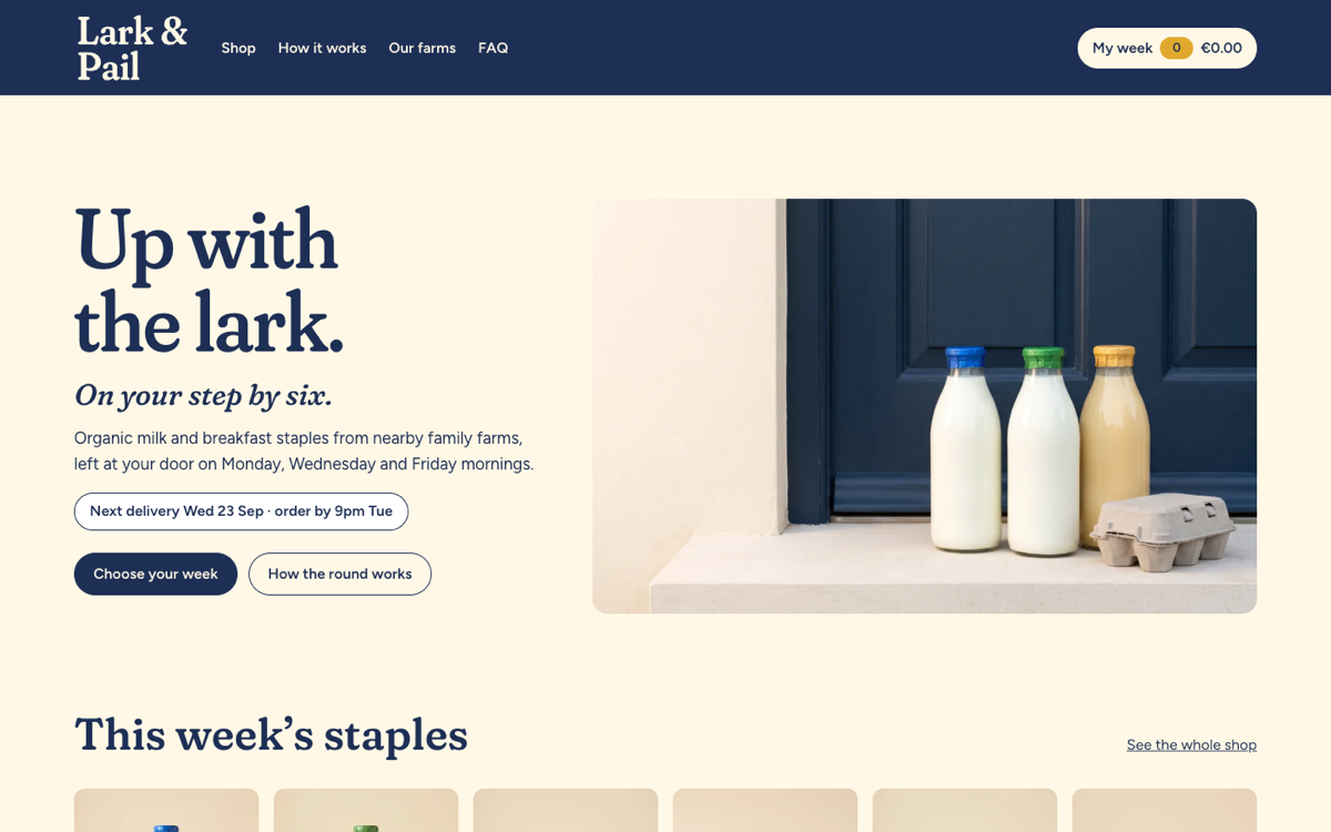 The Lark & Pail home page: the headline “Up with the lark.” beside a photograph of milk bottles and eggs on a doorstep.