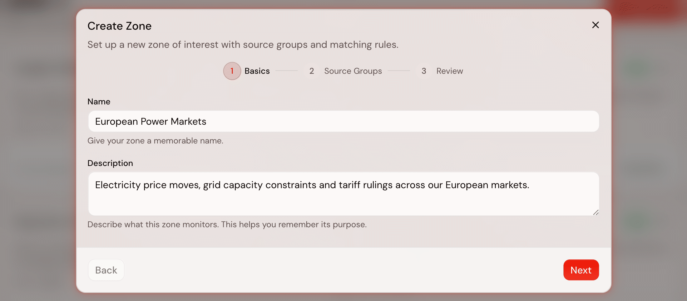 Step one of the zone wizard, Basics: a three-circle step indicator reading Basics, Source Groups and Review with Basics current, a Name field holding European Power Markets, a description field under it, and Back and Next in the footer.
